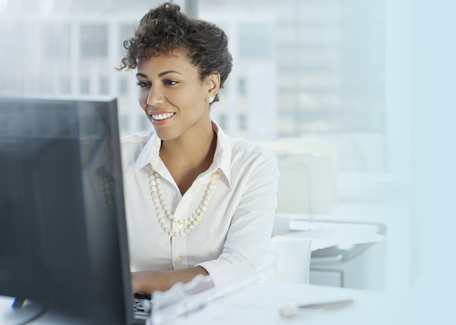women at desktop computer